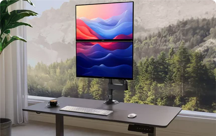 A modern workspace with a dual-monitor setup displaying vibrant abstract art