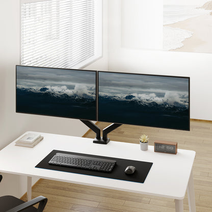 Dual monitor setup on desk with adjustable mount and ergonomic workspace